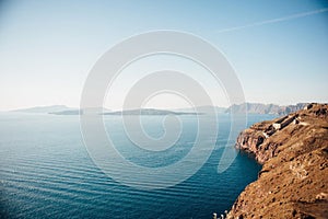 Traditional view of the island of Santorini with blue sea, islands