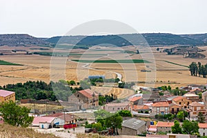 traditional village on the Castilian plateau in Spain with Romanesque Catholic church