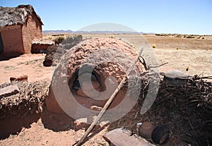 Traditional village with a clay oven in Bolivia photo