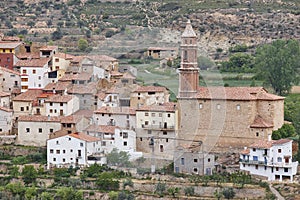 Traditional village with stone church. Seno, Teruel. Spain photo