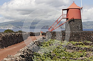 Traditional vineyard plantation windmill in Pico island. Azores.