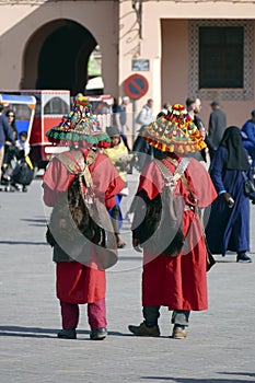 Traditional water seller in red uniform