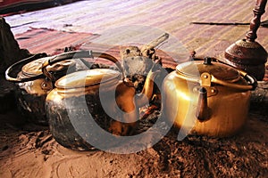 Traditional way of cooking Bedouin tea on an open fire in a desert Wadi Rum, Jordan