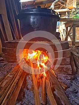 traditional way of cooking with a brick and wood-fired stove