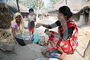 Traditional way of making food on open fire in kitchen, village Kumrokhali, India