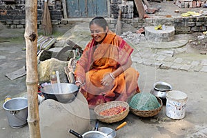 Traditional way of making food on open fire in a village, Kumrokhali, West Bengal, India