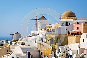 Traditional white architecture with blue churches on Santorini island, Greece