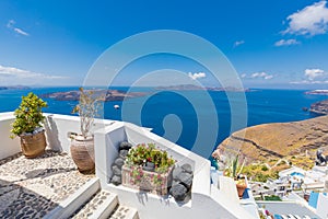 White concrete staircases leading down to beautiful bay with clear blue sky and sea