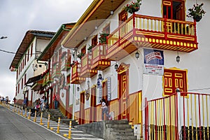 Traditional white buildings with colorful painted balconies, windows and doors, Salento, Colombia