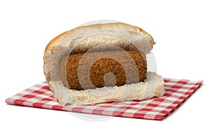 Traditional white bun with a Dutch kroket, called broodje kroket