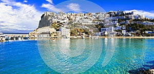 Traditional white houses and turquoise sea,Peschici village,Puglia,Italy.