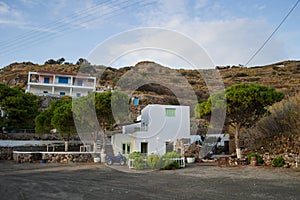 Traditional Whitewashed Greek Fishing Village House with ATV in