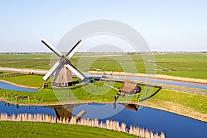 Traditional windmill in a dutch landscape