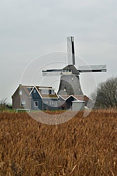 Traditional windmill in holland countryside