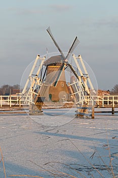 Traditional windmill and open drawbridge, Kinderdijk, Netherlands