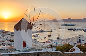 Traditional windmill over Mykonos Town at sunset