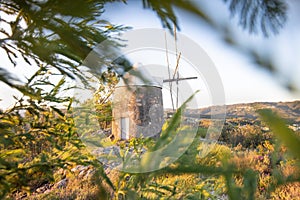 Traditional windmills in Central Portugal. Sunset in Coimbra, Portugal. Beautiful sunny day.