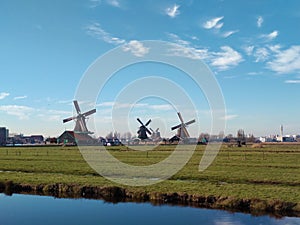 traditional windmills typical of zaanse schans in holland.