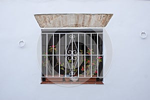 Traditional window of a Spanish village house in Vejer de la Frontera, Spain photo