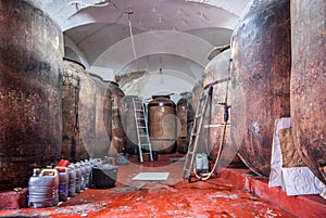 Traditional wine cellar with barrels in disrepair