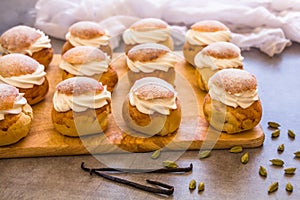 Traditional winter sweet: Semla semlor or fastlagsbulle flavored with cardamom, filled with almond paste & whipped cream