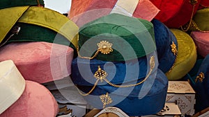 Traditional women's Asian headdresses are skullcaps made of thin velveteen with metal decorations.