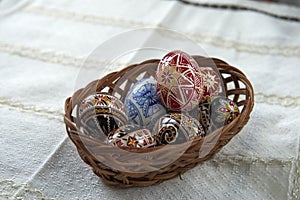 Traditional wood basket with painted Easter egg from Bucovina, Romania. photo