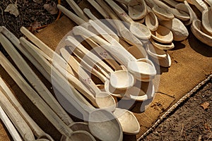Traditional wood spoons handcrafted by the locals in the rural villages of Romania photo