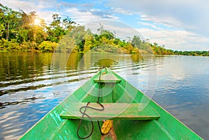 Traditional wooden boat floats on the Amazon river in the jungle. Amazon River Manaus, Amazonas, Brazil