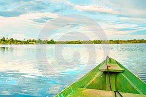 Traditional wooden boat floats on the Amazon river in the jungle. Amazon River Manaus, Amazonas, Brazil