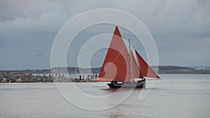 Traditional wooden boat Galway Hooker, leaving docks