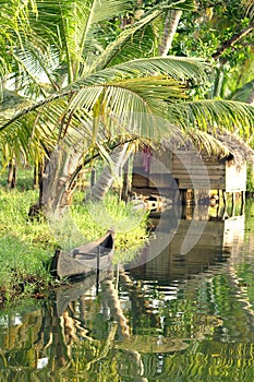Traditional wooden boat and hut