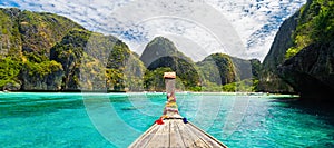 Traditional wooden boat in a picture perfect tropical bay on Koh Phi Phi Island, Thailand, Asia