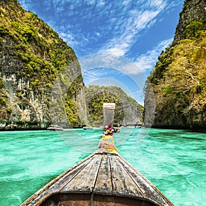 Traditional wooden boat in a picture perfect tropical bay on Koh Phi Phi Island, Thailand, Asia
