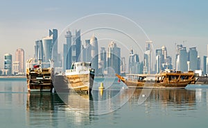 Traditional Wooden Boats in Corniche Harbor and Modern Doha Skyline in Background