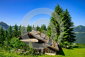 A traditional wooden building in mountains of Alps in summer in Portes du Soleil, France