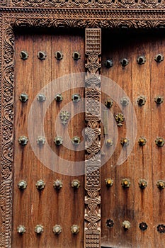 Traditional wooden carved door in Stone Town, Zanzibar, Tanzania