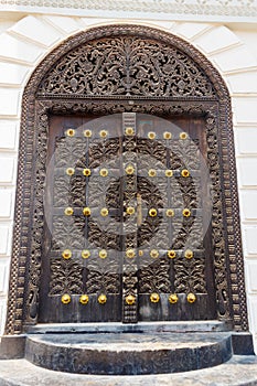 Traditional wooden carved door in Stone Town, Zanzibar, Tanzania