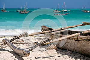 Traditional wooden dhow boats on the White Sand Beach with amazing turquoise water in the Indian ocean at Nungwi village