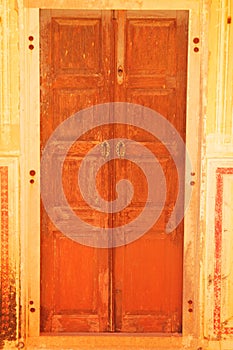 A traditional wooden door holding on to revive