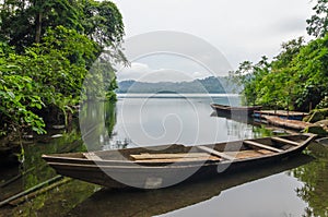 Traditional wooden fisher boat anchored at Barombi Mbo crater lake in Cameroon, Africa photo