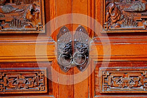 Traditional wooden gate with Lion door knockers at Qingshui Zushi Master Temple