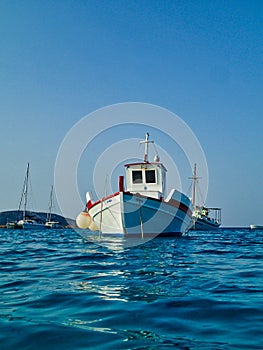 Traditional Wooden Greek Fishing Boat Moored in Open Water, Greece