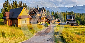 Traditional wooden house in the mountains on a green field Mountains, Poland