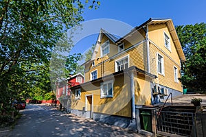 Traditional wooden house painted in traditional falun red and yellow with white window at street of Pargas town Parainen in