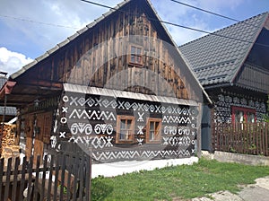 Traditional wooden houses with typical decorations in Cicmany, Slovakia