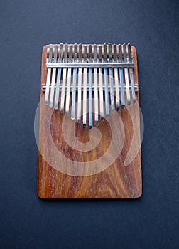 Traditional wooden kalimba isolated on black