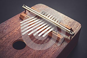 Traditional wooden kalimba isolated on black