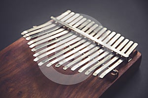 Traditional wooden kalimba isolated on black