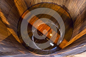 Traditional wooden mash tun at single malt whisky distillery in